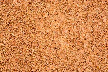 Natural brown stones wall background. Stone crumbの写真素材