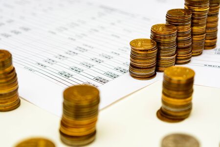 pile of coins and counting close upの写真素材