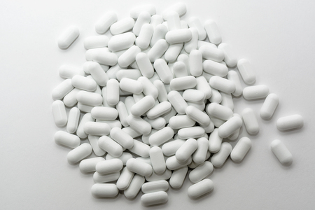 pile of pills on a white background.