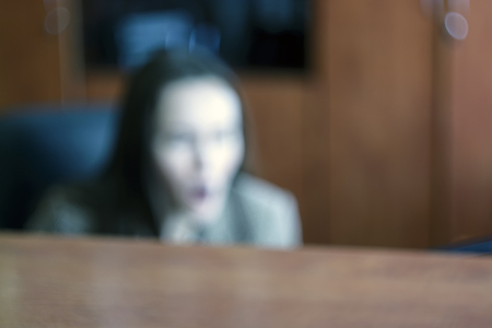 blurry girl yawns in the office, concept - boring jobの写真素材