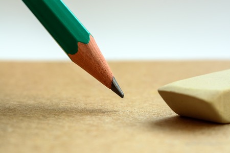 Craft paper background with pencil and eraser