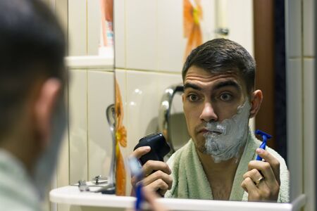 The man in front of a select electric shaver or razors classic. authenticの写真素材