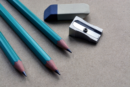 Shabby craft paper background with pencil and eraserの写真素材