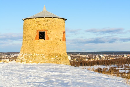 Old stone fortress on top of a snowy mountainの写真素材