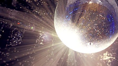 Bright patches of light on disco ball. The light at the party, the colored reflection of the mosaic glass ball discoの写真素材