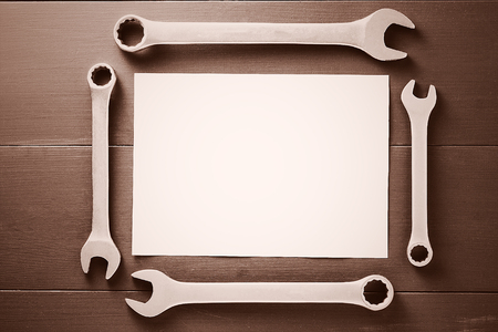 set of household tools on brown wooden surface. Tools background. Top view. Copy space. Tonedの写真素材