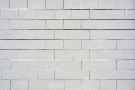 Abstract texture of a new clean wall of white brick blocks.