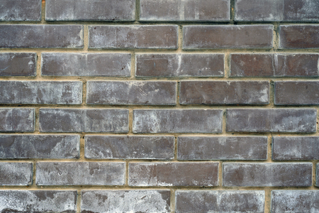 Abstract dirty raw wall texture of brown brick blocks with traces of mildew mould.の写真素材
