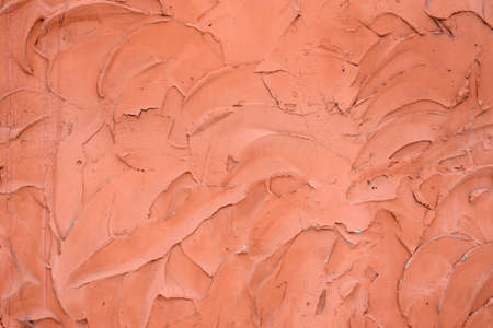 Abstract texture of concrete plaster of red color.