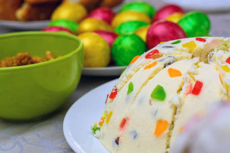 Festive cake, painted eggs on the table for Easter.