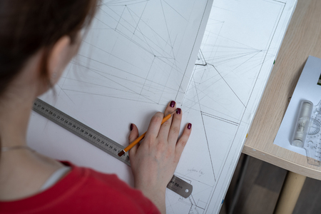 top view of the architect student draws a sketch projection of the building.の写真素材