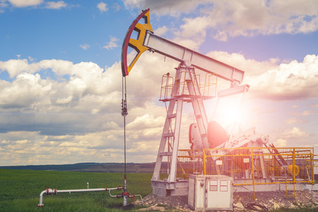 Oil and natural gas production tower with bright sunlight, glare.の写真素材