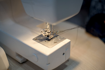 close-up details with sewing machine needle. needlework concept.