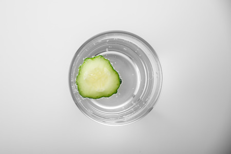 flat lay water with cucumber on white background. detox conceptの写真素材
