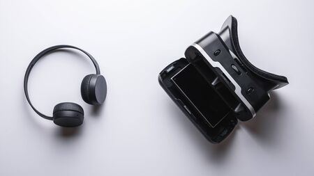 game gadgets for virtual reality. top view of VR glasses, smartphone and wireless headphones.の写真素材