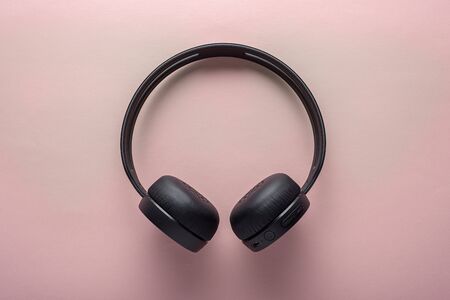 wireless headphones on pink background, minimalistic styleの写真素材