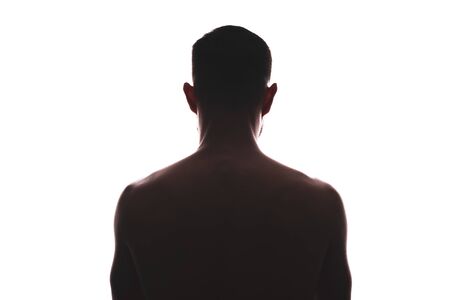 Male silhouette from back, muscular look isolated on whiteの写真素材