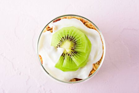 top view kiwi dessert in glass on pink backgroundの写真素材