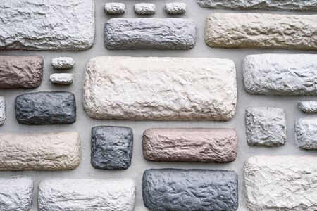 stone background and texture of multicolored bricks. wall covering conceptの写真素材