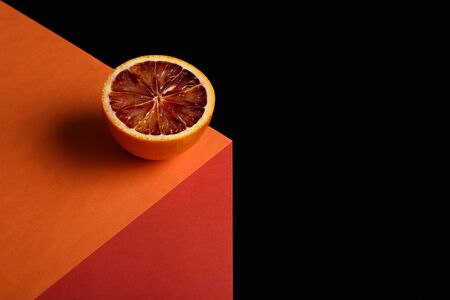 abstract image of red orange on illusionary cube on black background with copy spaceの写真素材