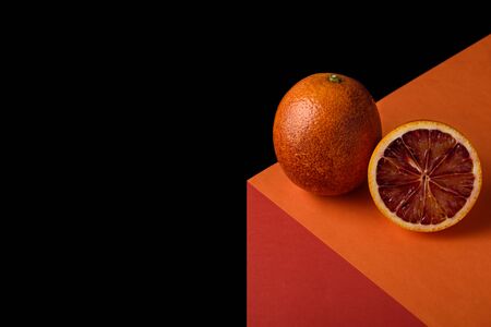 abstract geometric image of red orange on illusionary cube on black backgroundの写真素材
