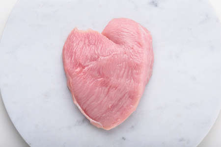Turkey, chicken fillet on white marble board, top view, copy space for catalogの写真素材
