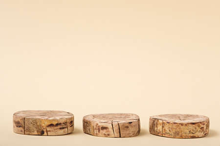 abstract three circle wooden platform on beige background, Empty showcase for presentation of...