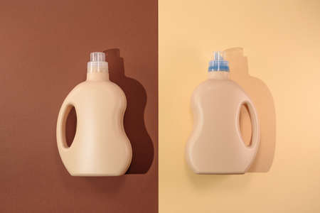 top view two plastic bottles containers on brown and beige background, mockup, branding, bottles of...