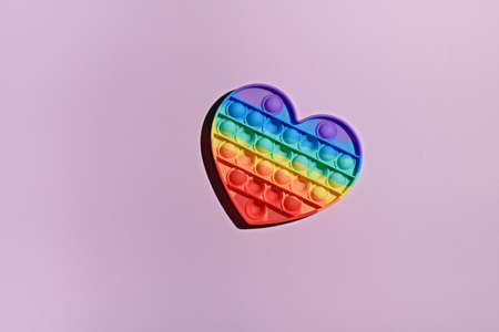 one trendy silicone  toy on pink background, copy space, top viewの写真素材