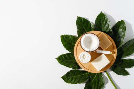 eco organic cosmetic on wooden board on white background, natural handmade soap, cream, hygienic...