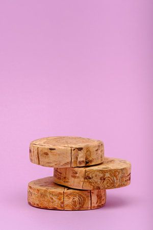 vertical three wooden sawn podium on pink background, ecoscene, showcase conceptの写真素材