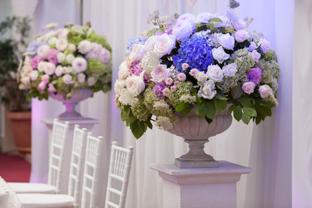Flowers in a vase for the wedding ceremony. Beautiful decorationの写真素材
