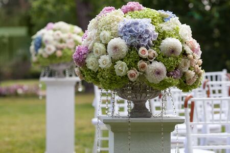 Beautiful wedding set up. Flowers in a vase for the wedding ceremonyの写真素材