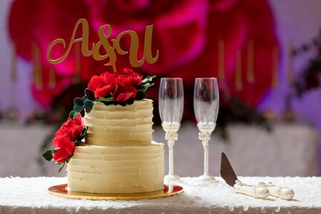 Beautiful wedding cake on the table in restaurantの写真素材