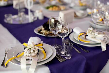 Wine glasses on table with other eating utensil