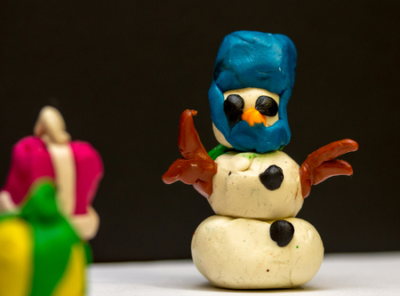 plasticine snowman on Christmas night gives everyone gifts and happiness. Great work from clayの写真素材