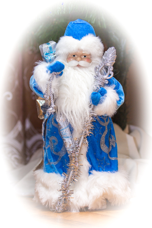 Beloved since childhood Santa Claus with a huge white beard, a long blue coat and a staffの写真素材