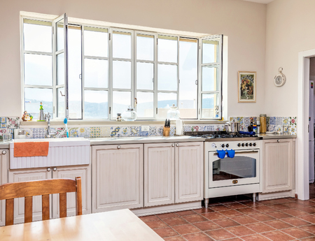 Modern kitchen Provence style with art painting and retro watch, Israel.のeditorial素材