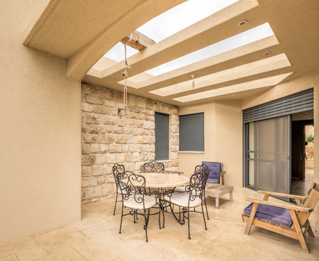Modern house patio with round table and chairs, Israel.のeditorial素材
