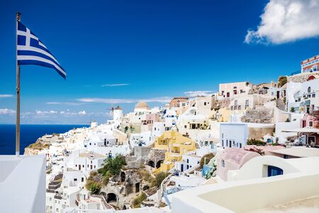 White city architecture, Greek flag with blue sea at Oia, Santorini, Greece.の写真素材