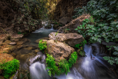 Banias river at north of Israel, flowing over rocks, shot with long exposure technique.の写真素材