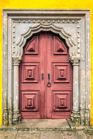 Colorful wooden door in the facade of a typical Portuguese house at Lisbon, Portugal.の写真素材