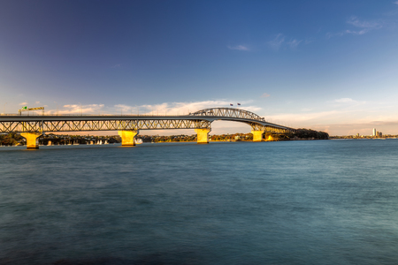 Auckland Harbour Bridge at sunset Auckland, New Zealand.の写真素材