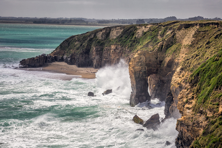 New Zealand coast with huge waves near Bluff, New Zealand.の写真素材