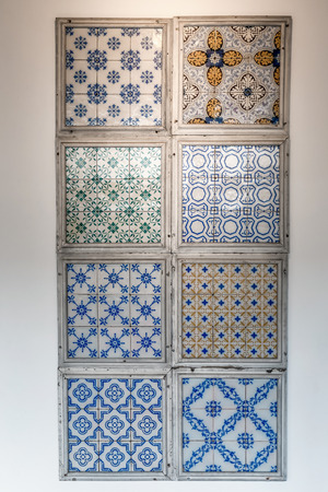 Typical traditional decoration of the facades in Lisbon. Traditional handmade ceramic tiles Azulejos.の写真素材