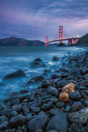 Famous Golden Gate Bridge shot at sunrise with long exposure at San Francisco, USA.の写真素材