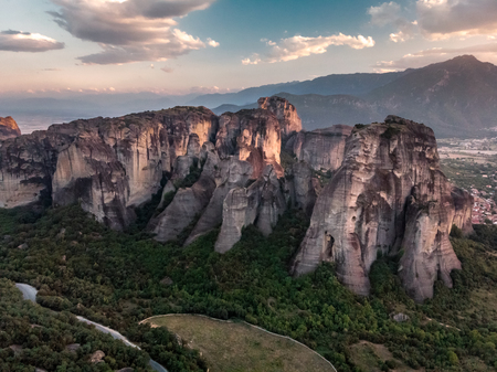 Monastery Meteora Greece. Stunning summer panoramic landscape. View at mountains and green forest against epic blue sky with clouds. UNESCO heritage list object.の写真素材