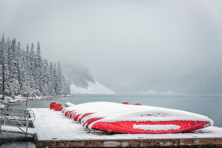 Canoe at Lake Louise under heavy snow at Banff National Park, Canada.の写真素材