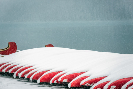 Canoe at Lake Louise under heavy snow at Banff National Park, Canada.の写真素材