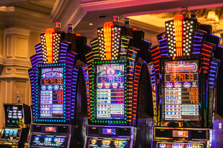 LAS VEGAS - JANUARY 24, 2018 : The Venetian Resort Hotel & Casino slot machines and gamblers. located in Nevada, USA.